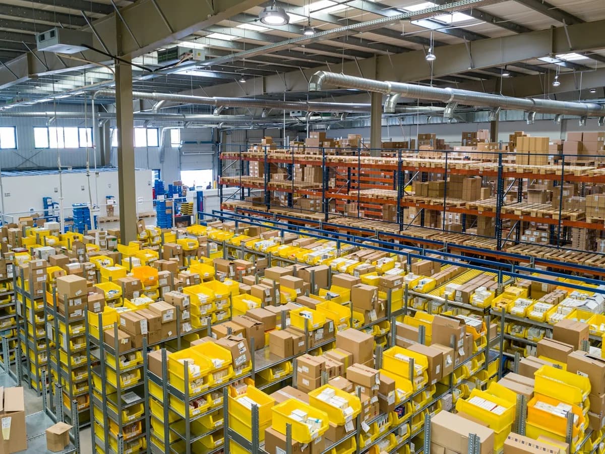 Organized industrial warehouse and logistics facility with clean aisles